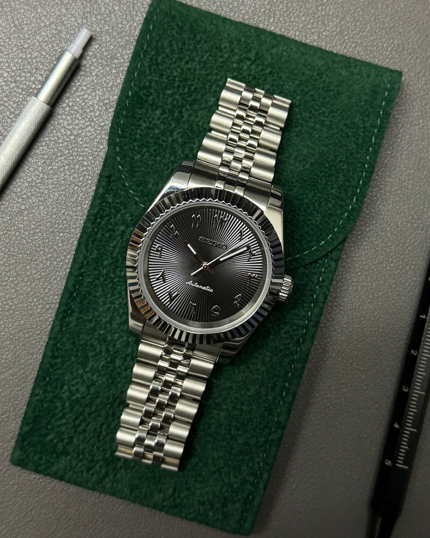 DateJust: Stainless Steel Guilloche Black Dial Arabic Marker w/ Jubilee Bracelet