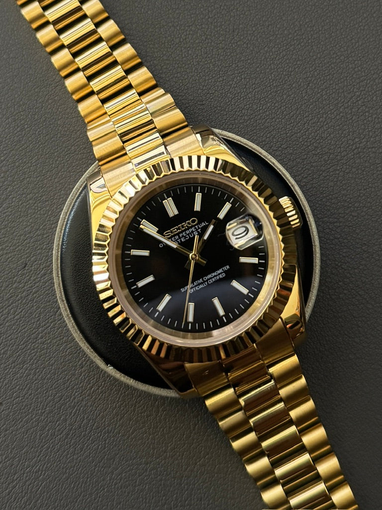 DateJust: Gold Black Dial Stick Markers w/ Presidential Bracelet