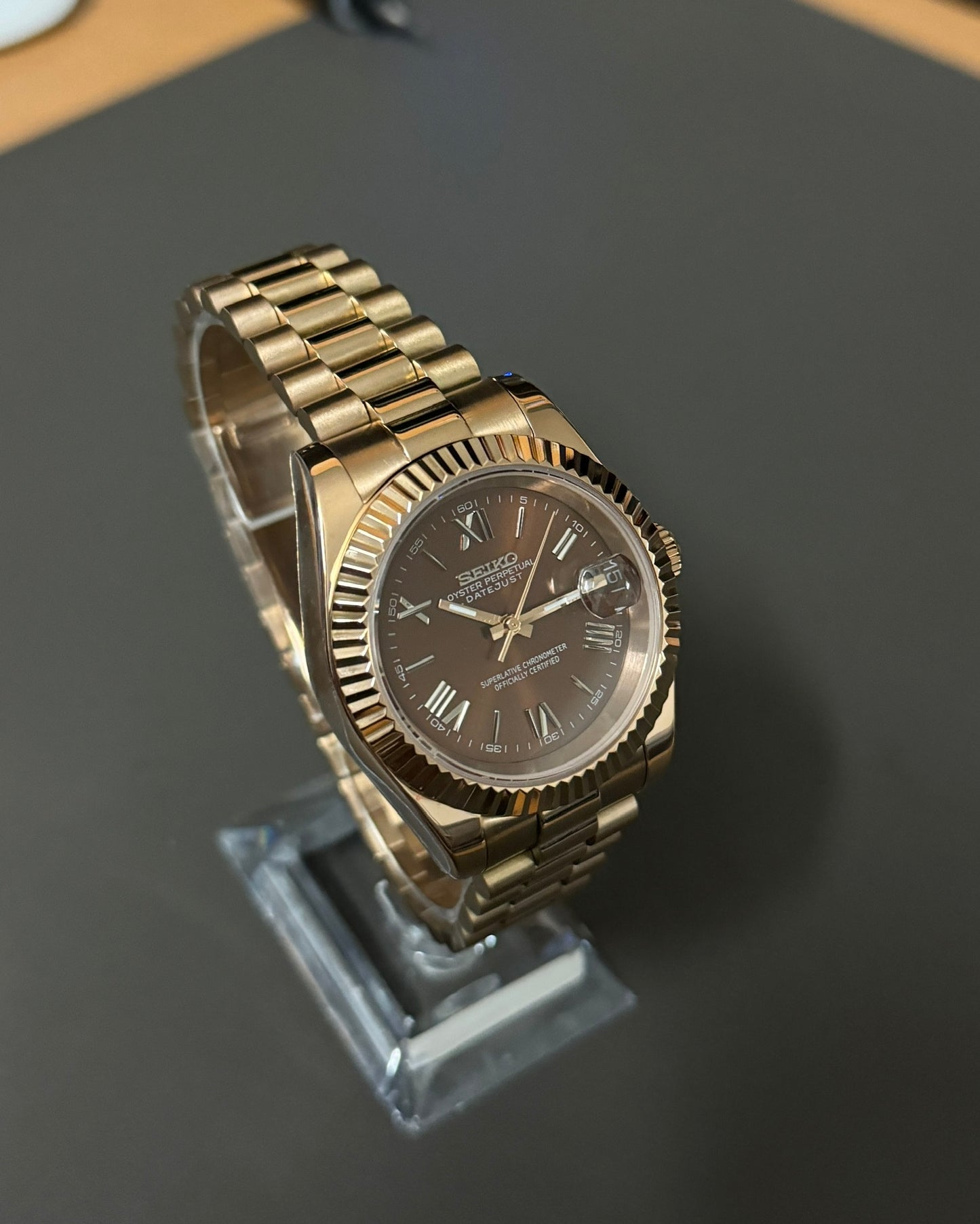DateJust: Rose Gold Chocolate Dial Roman Numerals Fluted Bezel on Presidential Bracelet