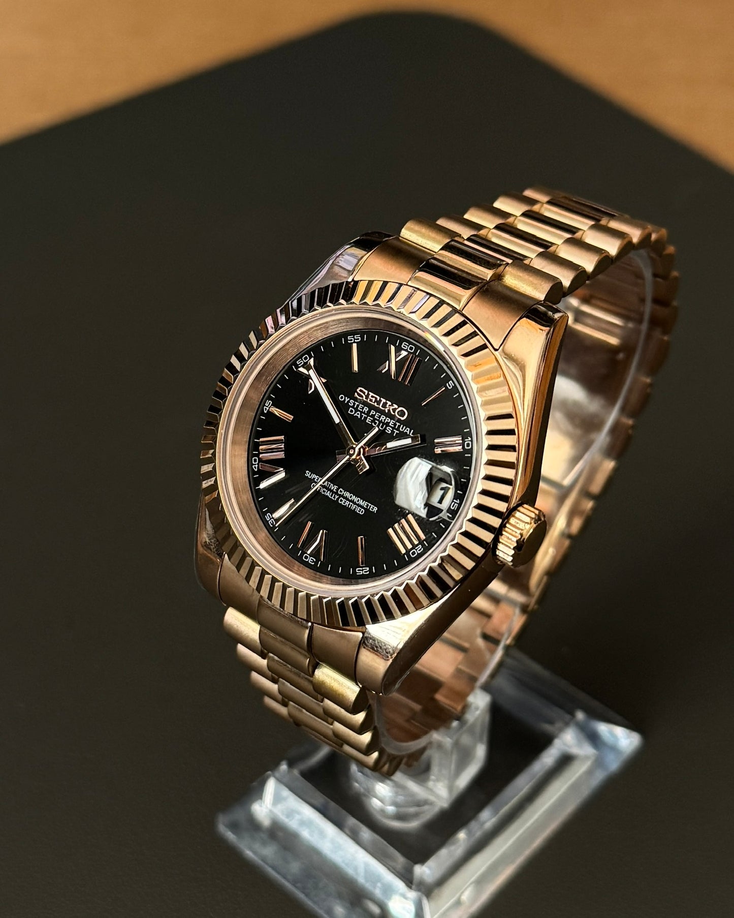 DateJust: Rose Gold Black Dial Roman Numeral Markers w/ Presidential Bracelet