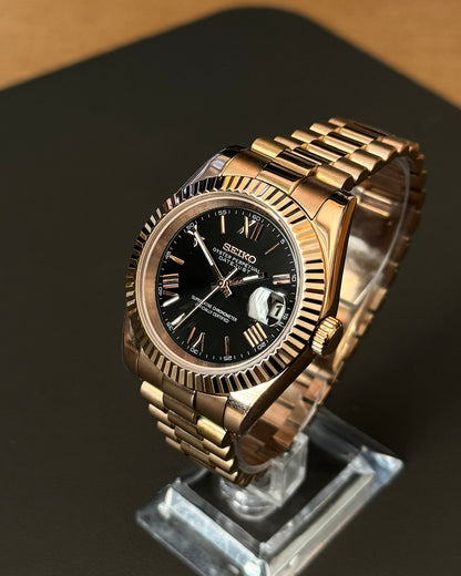 DateJust: Rose Gold Black Dial Roman Numeral Markers w/ Presidential Bracelet