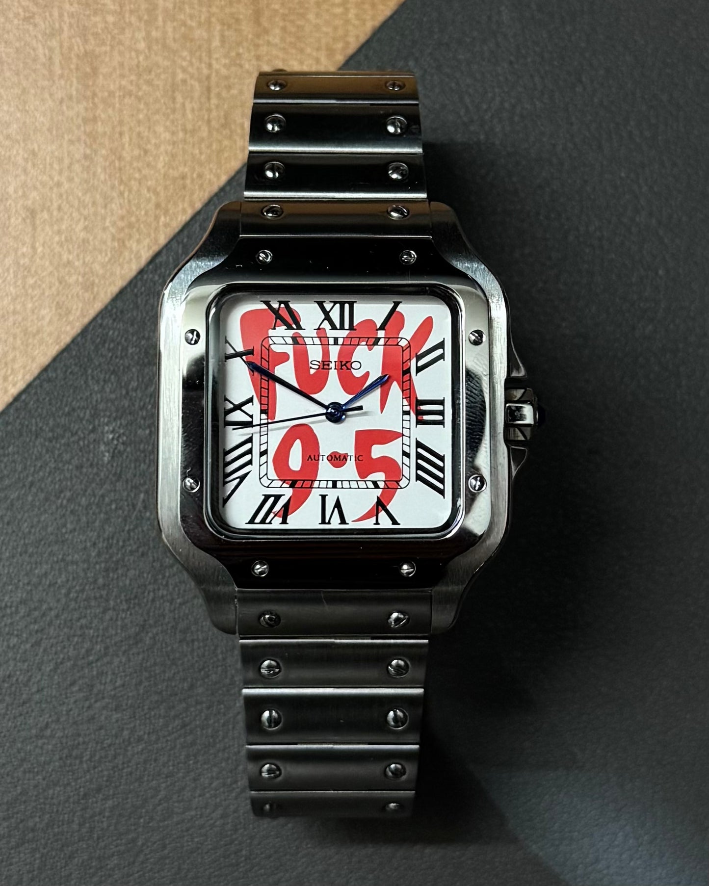 Santos: Stainless Steel White “Fuck 9-5” Dial Roman Markers