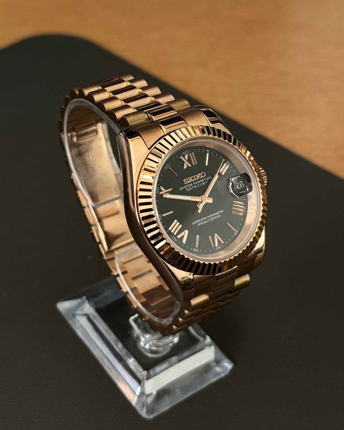 DateJust: Rose Gold Black Dial Roman Numeral Markers w/ Presidential Bracelet